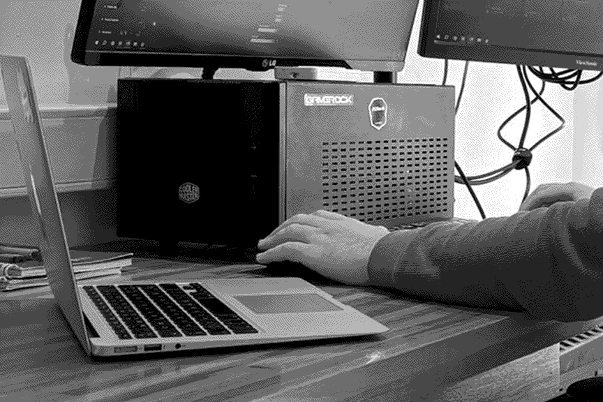an individual looking at a github pull request on a laptop